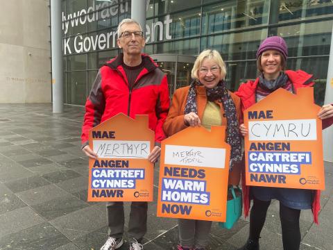 Climate Cymru gather outside the UK Government offices in Cardiff to call for warm homes